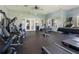 Well-equipped gym with weight machines, treadmills, and ample workout space at 2340 Grasmere View S Pkwy, Kissimmee, FL 34746