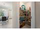 Walk-in pantry featuring ample storage shelves filled with food and household items at 2340 Grasmere View S Pkwy, Kissimmee, FL 34746