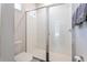 This tiled shower features seamless glass doors and a bright interior at 2340 Grasmere View S Pkwy, Kissimmee, FL 34746