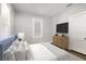Comfortable bedroom with a plush bed, stylish furnishings, neutral decor, and natural light at 2504 Yale Ave, Sanford, FL 32773
