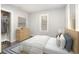 Bright bedroom with a comfortable bed, dresser, and ample closet space, featuring hardwood floors at 2504 Yale Ave, Sanford, FL 32773