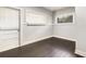 Cozy bedroom featuring warm wood floors and ample natural light, enhanced by a fresh, neutral color palette at 2504 Yale Ave, Sanford, FL 32773