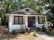 Charming single-story home with a cozy front porch and neatly landscaped yard at 2504 Yale Ave, Sanford, FL 32773