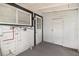 Rear enclosed porch with a white wood construction, offering a versatile space with a mix of utility and views at 2504 Yale Ave, Sanford, FL 32773