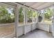 Enclosed porch with screening and white wood construction, offering a versatile indoor-outdoor living space at 2504 Yale Ave, Sanford, FL 32773