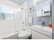 Clean and bright bathroom with shower-tub combo and sleek white vanity providing a modern feel at 2707 Chelsea St, Orlando, FL 32803