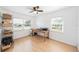 Bright bedroom featuring natural light, a ceiling fan, and an adjacent shelving unit, perfect for an office at 2707 Chelsea St, Orlando, FL 32803