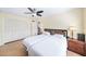 Bright bedroom with neutral walls, hardwood floors, a ceiling fan, and closet at 2707 Chelsea St, Orlando, FL 32803