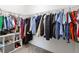 Walk-in closet boasts ample hanging space with a built-in shelving unit for optimal organization at 2934 Title St, Kissimmee, FL 34746