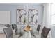 Bright dining room features elegant lighting, modern decor, and stylish glass table at 2934 Title St, Kissimmee, FL 34746