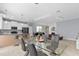 Open concept living space with kitchen, dining area, and living room all connected at 2934 Title St, Kissimmee, FL 34746