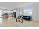 Spacious living area with a modern kitchen, comfortable seating, and bright natural light at 2934 Title St, Kissimmee, FL 34746