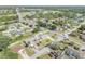 Wide aerial view showing the home's location in a verdant residential neighborhood at 2945 Juniper Dr, Edgewater, FL 32141
