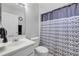 Bathroom featuring a shower with patterned curtain, white vanity, and mirror at 2945 Juniper Dr, Edgewater, FL 32141