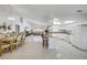 Open-concept kitchen with white cabinets, granite countertops, and tile flooring at 2945 Juniper Dr, Edgewater, FL 32141