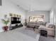 Modern living room with a large television, ceiling fan, neutral tones and comfortable sectional at 2945 Juniper Dr, Edgewater, FL 32141