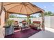 Outdoor patio area with comfortable seating under a shaded gazebo, perfect for relaxation at 2945 Juniper Dr, Edgewater, FL 32141
