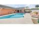 Large, in-ground pool with plenty of lounge chairs for relaxing by the water at 2945 Juniper Dr, Edgewater, FL 32141