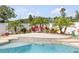 Backyard pool with tropical landscaping that creates a private retreat at 2945 Juniper Dr, Edgewater, FL 32141