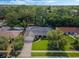 Aerial view of home features pool, mature trees, and a well-maintained lawn at 3015 Dawley Ave, Orlando, FL 32806