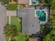 Aerial view of a charming single-story home showcasing a private pool, lush lawn, and well-manicured landscaping at 3015 Dawley Ave, Orlando, FL 32806