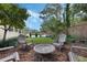 Spacious backyard with patio, lounge furniture, mature landscaping, and privacy fence at 3015 Dawley Ave, Orlando, FL 32806