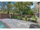 Expansive backyard with concrete patio, privacy fence, and lush landscaping at 3015 Dawley Ave, Orlando, FL 32806