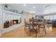 Dining area featuring a stone fireplace, wood flooring and views of living room at 3015 Dawley Ave, Orlando, FL 32806