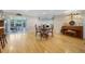 Elegant dining room with hardwood floors, charming fireplace, and view of lanai at 3015 Dawley Ave, Orlando, FL 32806
