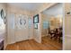 Welcoming foyer featuring hardwood floors, a decorative mirror, and access to the dining area at 3015 Dawley Ave, Orlando, FL 32806