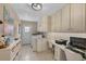 Well-lit laundry room featuring modern appliances, ample storage, and a functional workspace with a built-in desk at 3015 Dawley Ave, Orlando, FL 32806