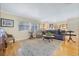 Cozy living room featuring hardwood floors, comfortable seating, and a decorative area rug at 3015 Dawley Ave, Orlando, FL 32806