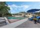 Gorgeous in-ground pool with patio area and stylish furniture creates a private backyard oasis at 3015 Dawley Ave, Orlando, FL 32806