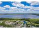 Scenic aerial view of a community with lush greenery, blue lakes, and beautiful residential homes at 3312 Cordgrass Pl, St Cloud, FL 34773