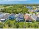 Aerial view of home showing backyard and surrounding area with pond and golf course in the distance at 3312 Cordgrass Pl, St Cloud, FL 34773