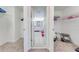 Bright bathroom featuring dual walk in closets, double sinks and white cabinets at 3312 Cordgrass Pl, St Cloud, FL 34773