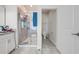 Bright bathroom featuring a tiled shower and a separate toilet room at 3312 Cordgrass Pl, St Cloud, FL 34773