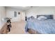 Bedroom featuring neutral carpet, closet space and a comfortable queen bed at 3312 Cordgrass Pl, St Cloud, FL 34773