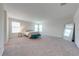 Spacious bedroom boasts neutral carpet and natural light from large windows at 3312 Cordgrass Pl, St Cloud, FL 34773