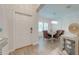Bright dining area features modern lighting, beautiful floors, and ample natural light at 3312 Cordgrass Pl, St Cloud, FL 34773