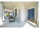 Inviting front porch with seating and decor creating a welcoming entrance at 3312 Cordgrass Pl, St Cloud, FL 34773