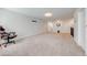 Spacious game room with neutral carpet and ready for entertainment at 3312 Cordgrass Pl, St Cloud, FL 34773