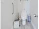 Clean half bathroom featuring a modern toilet, stylish fixtures, and a minimalist design at 3312 Cordgrass Pl, St Cloud, FL 34773