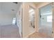 View of laundry room and bedroom from hallway at 3312 Cordgrass Pl, St Cloud, FL 34773