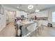 Modern kitchen features a large island, stainless steel appliances, and ample counter space at 3312 Cordgrass Pl, St Cloud, FL 34773