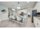 Bright kitchen features granite counters, island with seating, and stainless steel appliances at 3312 Cordgrass Pl, St Cloud, FL 34773