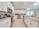 Modern kitchen with stainless steel appliances, granite countertops, and ample cabinet space at 3312 Cordgrass Pl, St Cloud, FL 34773
