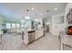 Bright kitchen features granite counters, island with seating, and stainless steel appliances at 3312 Cordgrass Pl, St Cloud, FL 34773