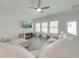 Light and bright living room with ceiling fan, large windows and a comfortable sectional couch at 3312 Cordgrass Pl, St Cloud, FL 34773