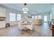 Inviting living space with modern lighting, an adjacent kitchen and a comfortable sectional sofa at 3312 Cordgrass Pl, St Cloud, FL 34773